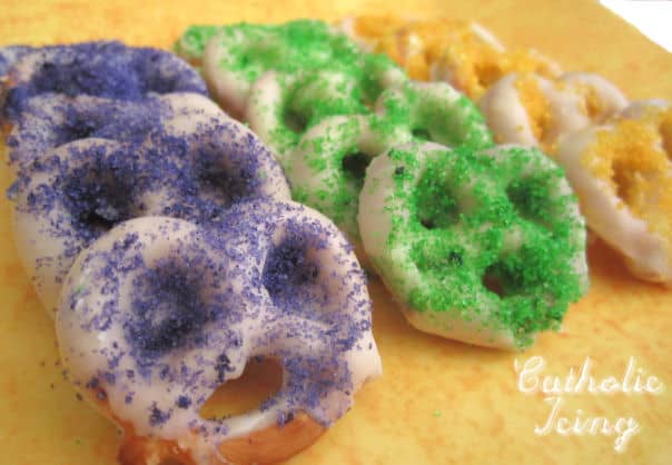 Finished purple, green, and gold sugar covered pretzels
