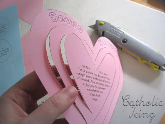 Paper heart mobile cutout.
