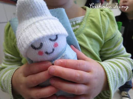 preschooler loving baby jesus sock craft